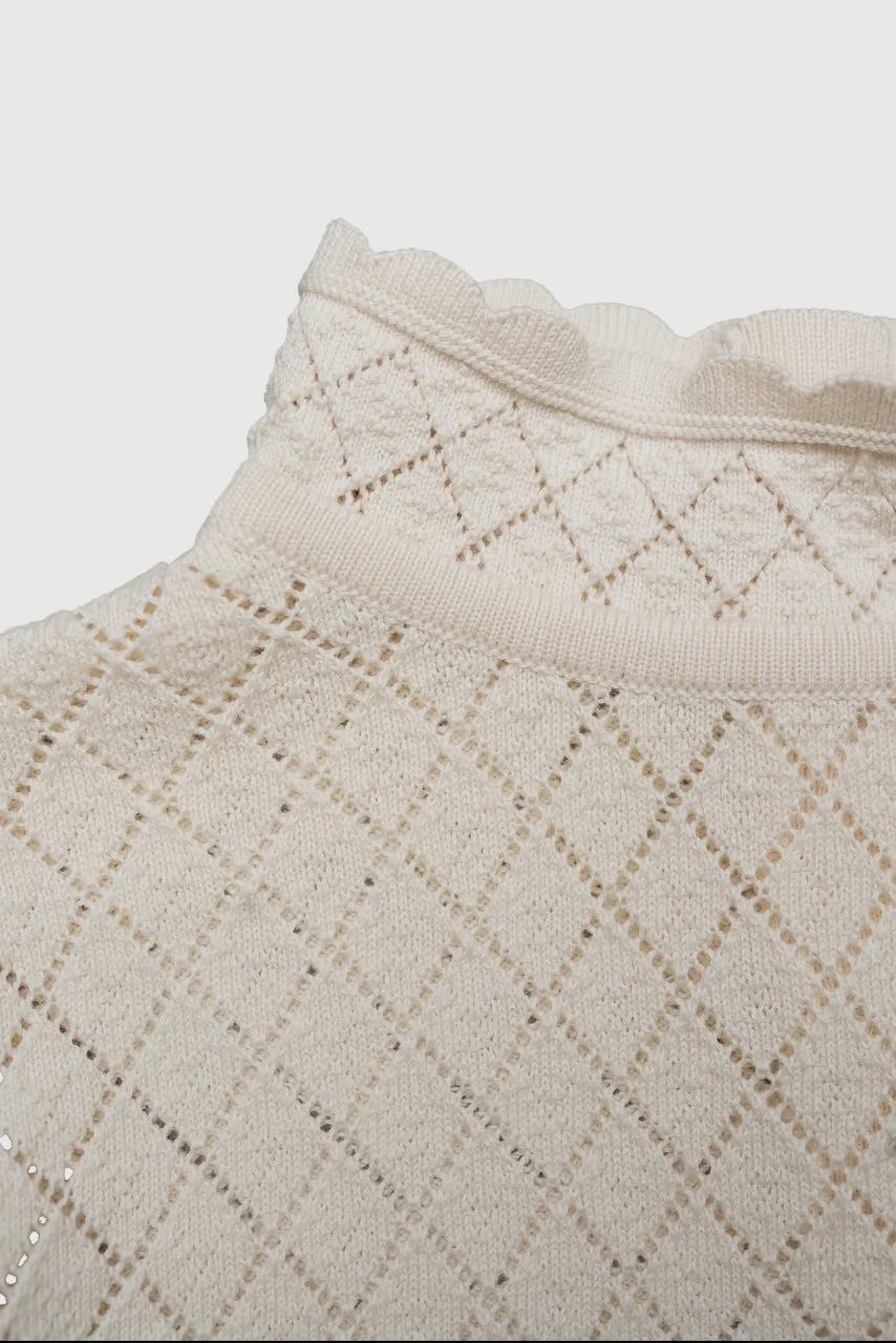 Maglioncino bimba lavorazione a maglia traforata a rombi.