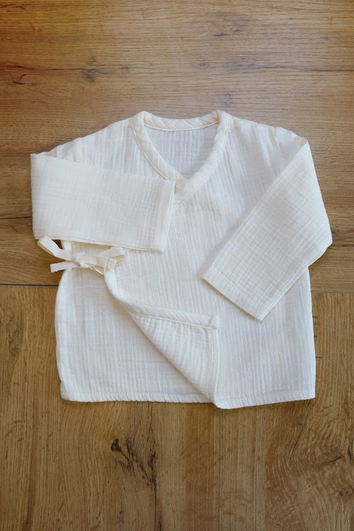 Cardigan avvolgente in mussola di cotone 100% crema per neonati